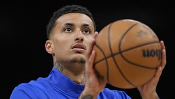 Feb 23, 2025; Milwaukee, Wisconsin, USA;  Milwaukee Bucks forward Kyle Kuzma (18) shoots during warmups prior to the game against the Miami Heat at Fiserv Forum. Mandatory Credit: Jeff Hanisch-Imagn Images