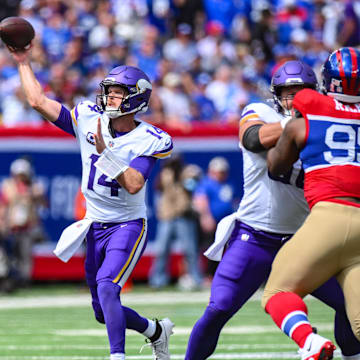 Sep 8, 2024; East Rutherford, New Jersey, USA; Minnesota Vikings quarterback Sam Darnold (14) throws a pass against the New York Giants during the first half at MetLife Stadium.