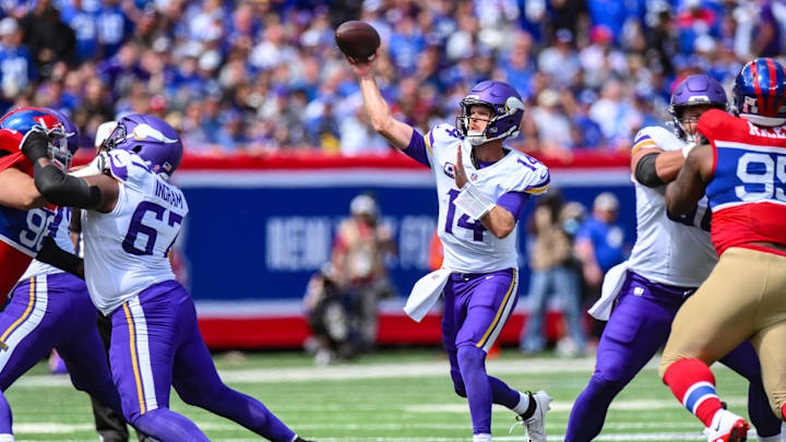 Sep 8, 2024; East Rutherford, New Jersey, USA; Minnesota Vikings quarterback Sam Darnold (14) throws a pass against the New York Giants during the first half at MetLife Stadium.