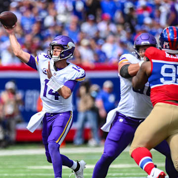 Sep 8, 2024; East Rutherford, New Jersey, USA; Minnesota Vikings quarterback Sam Darnold (14) throws a pass against the New York Giants during the first half at MetLife Stadium. Mandatory Credit: John Jones-Imagn Images