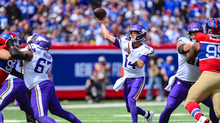 Sep 8, 2024; East Rutherford, New Jersey, USA; Minnesota Vikings quarterback Sam Darnold (14) throws a pass against the New York Giants during the first half at MetLife Stadium. Mandatory Credit: John Jones-Imagn Images