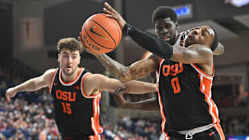 Jan 28, 2025; Spokane, Washington, USA; Oregon State Beavers guard Damarco Minor (0) fights for the rebound against Gonzaga Bulldogs forward Graham Ike (13) in the second half at McCarthey Athletic Center. Mandatory Credit: James Snook-Imagn Images