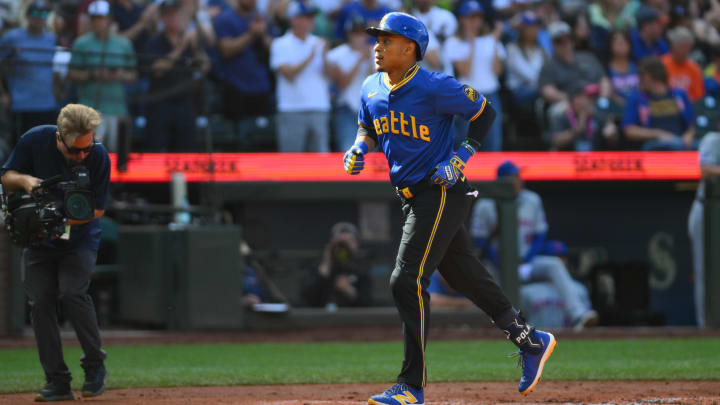 Seattle Mariners second baseman Jorge Polanco crosses home plate after hitting a home run against the New York Mets on Sunday at T-Mobile Park.