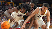Arizona State's Jayden Quaintance (21) and Basheer Jihad (8) battle for a loose ball with Houston's Joseph Tugler (11) in the second half at Desert Financial Arena.