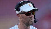 Oct 21, 2023; Los Angeles, California, USA; Southern California Trojans head coach Lincoln Riley watches from the sidelines against the Utah Utes in the first half at United Airlines Field at Los Angeles Memorial Coliseum. Mandatory Credit: Kirby Lee-Imagn Images