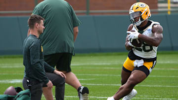 Jun 11, 2024; Green Bay, WI, USA; Green Bay Packers running back AJ Dillon (28) carries during minicamp. Mandatory Credit: Mark Hoffman-Imagn Images