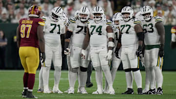 The Green Bay Packers offensive line is shown during the first quarter of their game against the Washington Commanders Thursday, September 11, 2025 at Lambeau Field in Green Bay, Wisconsin. Shown are offensive tackle Anthony Belton (71), guard Sean Rhyan (75), guard Elgton Jenkins (74), offensive tackle Jordan Morgan (77) and offensive tackle Rasheed Walker (63).