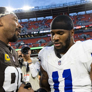 Cleveland Browns defensive end Myles Garrett congratulates Dallas Cowboys linebacker Micah Parsons