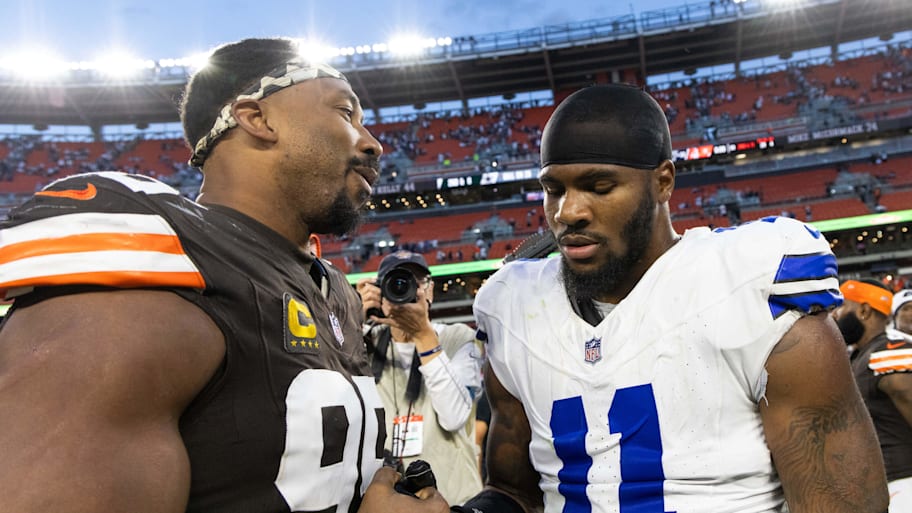 Cleveland Browns defensive end Myles Garrett talks to Dallas Cowboys linebacker Micah Parsons after a game. | Scott Galvin-Imagn Images