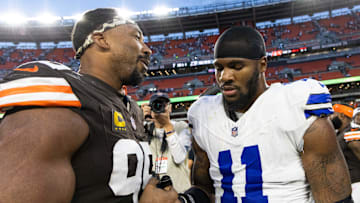 Cleveland Browns defensive end Myles Garrett congratulates Dallas Cowboys linebacker Micah Parsons after the game.