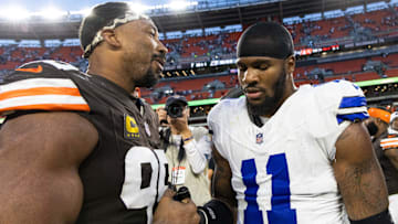 Cleveland Browns defensive end Myles Garrett (95) congratulates Dallas Cowboys linebacker Micah Parsons (11) after the game at Huntington Bank Field.