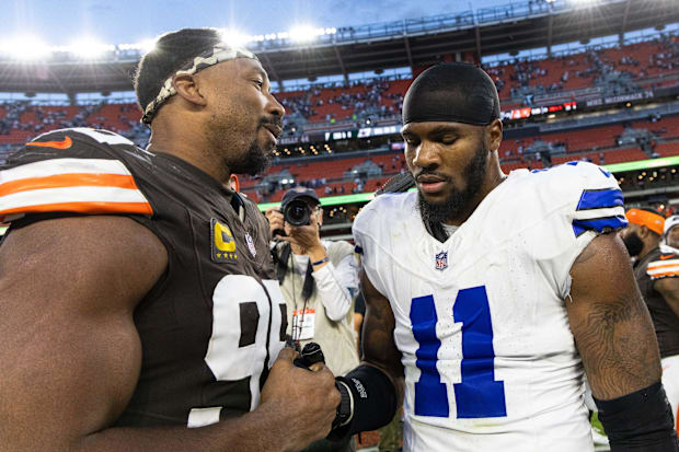 Cleveland Browns defensive end Myles Garrett congratulates Dallas Cowboys linebacker Micah Parsons after a game.