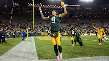 Nov 28, 2024; Green Bay, Wisconsin, USA;  Green Bay Packers wide receiver Christian Watson (9) celebrates while holding a turkey leg on his way off the field following the game against the Miami Dolphins at Lambeau Field. Mandatory Credit: Jeff Hanisch-Imagn Images