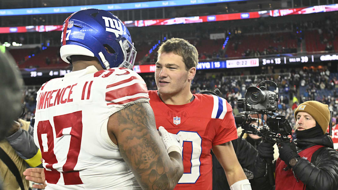 Dec 1, 2025; Foxborough, Massachusetts, USA; New York Giants defensive tackle Dexter Lawrence II (97) and New England Patriots quarterback Drake Maye (10) greet each other after the game at Gillette Stadium. Mandatory Credit: Eric Canha-Imagn Images Dec 1, 2025; Foxborough, Massachusetts, USA; New York Giants defensive tackle Dexter Lawrence II (97) and New England Patriots quarterback Drake Maye (10) greet each other after the game at Gillette Stadium. Mandatory Credit: Eric Canha-Imagn Images