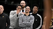 Oct 29, 2025; Dallas, Texas, USA; Indiana Pacers guard Tyrese Haliburton (left) and guard Andrew Nembhard (center) laugh on the sidelines during the second half of the game against the Dallas Mavericks at the American Airlines Center. Mandatory Credit: Jerome Miron-Imagn Images
