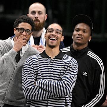 Oct 29, 2025; Dallas, Texas, USA; Indiana Pacers guard Tyrese Haliburton (left) and guard Andrew Nembhard (center) laugh on the sidelines during the second half of the game against the Dallas Mavericks at the American Airlines Center. Mandatory Credit: Jerome Miron-Imagn Images