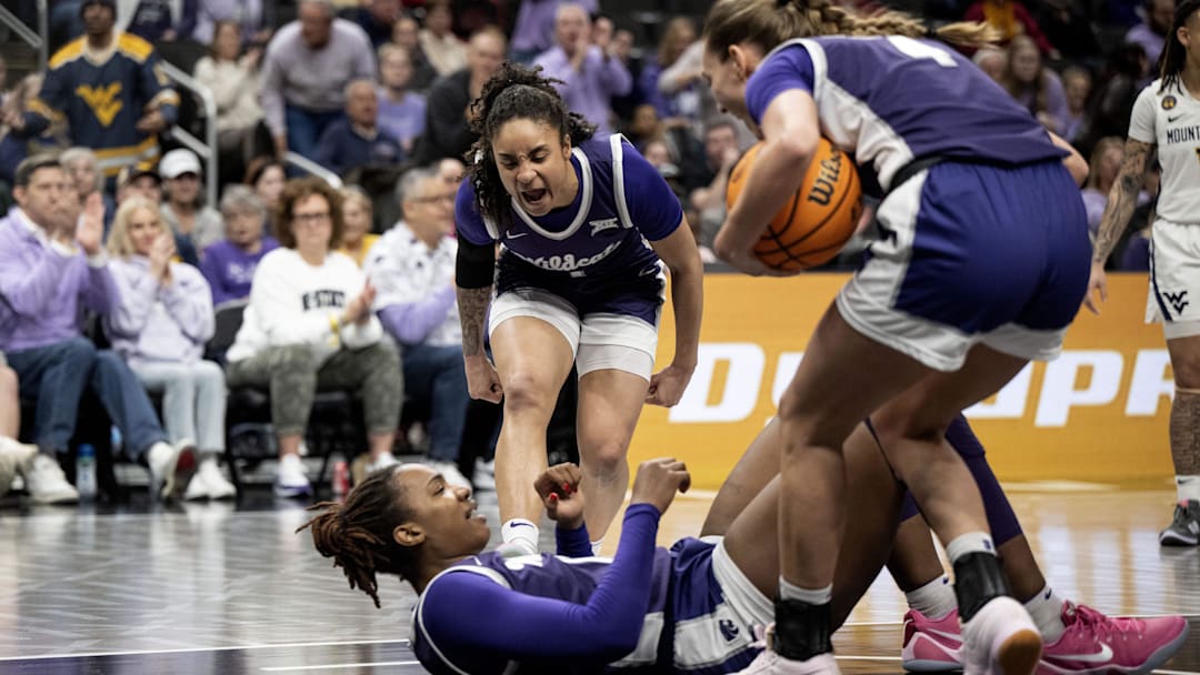 Mar 7, 2025; Kansas City, MO, USA; Kansas State Wildcats guard Zyanna Walker (1) celebrates Kansas State Wildcats forward Kennedy Taylor (12) taking a charge against the West Virginia Mountaineers in the first quarter at T-Mobile Center. Mandatory Credit: Amy Kontras-Imagn Images