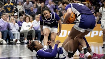 Mar 7, 2025; Kansas City, MO, USA; Kansas State Wildcats guard Zyanna Walker (1) celebrates Kansas State Wildcats forward Kennedy Taylor (12) taking a charge against the West Virginia Mountaineers in the first quarter at T-Mobile Center. Mandatory Credit: Amy Kontras-Imagn Images