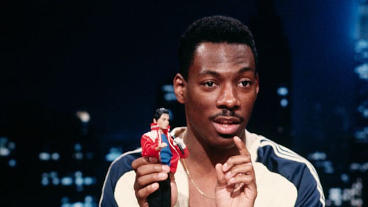 Eddie Murphy Holding Ken Doll