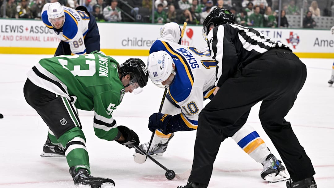 Mar 2, 2025; Dallas, Texas, USA; Dallas Stars center Wyatt Johnston (53) and St. Louis Blues center Brayden Schenn (10) take the face-off during the game between the Dallas Stars and the St. Louis Blues at the American Airlines Center. Mandatory Credit: Jerome Miron-Imagn Images