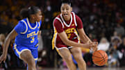 Feb 13, 2025; Los Angeles, California, USA;  USC Trojans guard JuJu Watkins (12) loses the ball against UCLA Bruins guard Londynn Jones (3) during the third quarter at Galen Center. Mandatory Credit: Robert Hanashiro-Imagn Images
