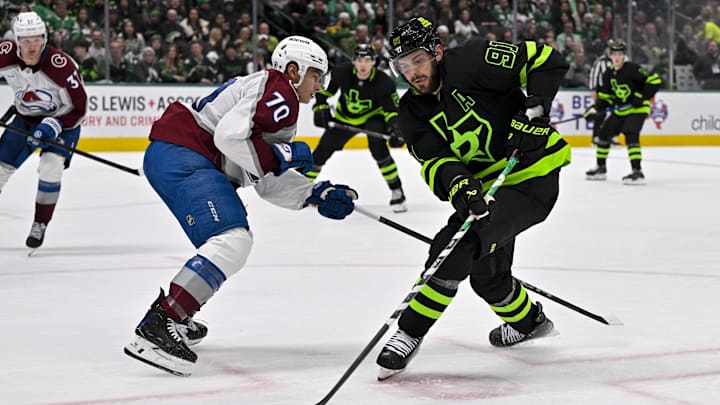 Nov 29, 2024; Dallas, Texas, USA; Dallas Stars center Tyler Seguin (91) and Colorado Avalanche defenseman Sam Malinski (70) in action during the game between the Dallas Stars and the Colorado Avalanche at American Airlines Center. Mandatory Credit: Jerome Miron-Imagn Images