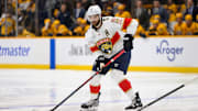 Feb 25, 2025; Nashville, Tennessee, USA;  Florida Panthers defenseman Aaron Ekblad (5) skates with the puck against the Nashville Predators during the second period at Bridgestone Arena. Mandatory Credit: Steve Roberts-Imagn Images