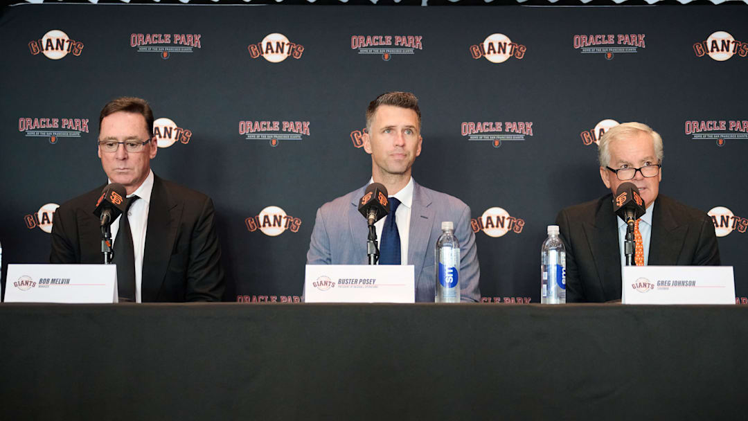 Oct 1, 2024; San Francisco, CA, USA; San Francisco Giants manager Bob Melvin (left), president of baseball operations Buster Posey (middle), and chairman Greg Johnson during a press conference at Oracle Park.  Mandatory Credit: Robert Edwards-Imagn Images