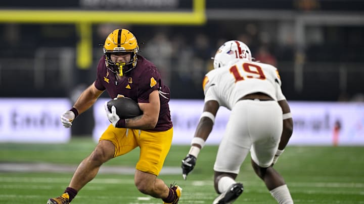 Dec 7, 2024; Arlington, TX, USA; Arizona State Sun Devils running back Cam Skattebo (4) and Iowa State Cyclones defensive back Ta'Shawn James (19) in action during the game between the Iowa State Cyclones and the Arizona State Sun Devils at AT&T Stadium.