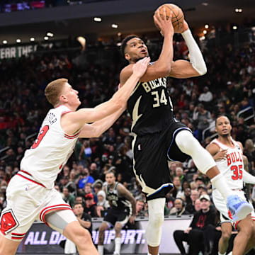 Nov 7, 2025; Milwaukee, Wisconsin, USA: Milwaukee Bucks forward Giannis Antetokounmpo (34) drives for the basket against Chicago Bulls guard Kevin Huerter (13) in the 3rd quarter at Fiserv Forum. Mandatory Credit: Benny Sieu-Imagn Images