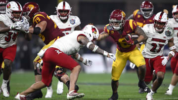 Dec 27, 2023; San Diego, CA, USA; USC Trojans running back Austin Jones (6) runs the ball defended