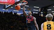 Dec 6, 2025; Iowa City, Iowa, USA; Maryland Terrapins forward Pharrel Payne (21) completes a slam dunk against the Iowa Hawkeyes during the first half at Carver-Hawkeye Arena. Mandatory Credit: Jeffrey Becker-Imagn Images