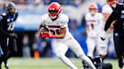 Nov 30, 2024; Lexington, Kentucky, USA; Louisville Cardinals running back Duke Watson (26) runs the ball during the third quarter against the Kentucky Wildcats at Kroger Field. Mandatory Credit: Jordan Prather-Imagn Images