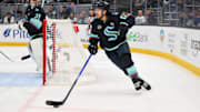 Dec 14, 2024; Seattle, Washington, USA; Seattle Kraken left wing Brandon Tanev (13) plays the puck during the second period against the Tampa Bay Lightning at Climate Pledge Arena. Mandatory Credit: Steven Bisig-Imagn Images