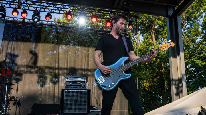 Keanu Reeves plays the bass Thursday, Aug. 8, 2024, during a performance by Dogstar at the Hoosier Lottery Free Stage at the Indiana State Fair in Indianapolis.