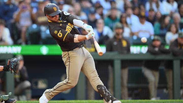 May 17, 2026; Seattle, Washington, USA; San Diego Padres first baseman Ty France (25) hits an RBI single against the Seattle Mariners during the fifth inning at T-Mobile Park. Mandatory Credit: Steven Bisig-Imagn Images