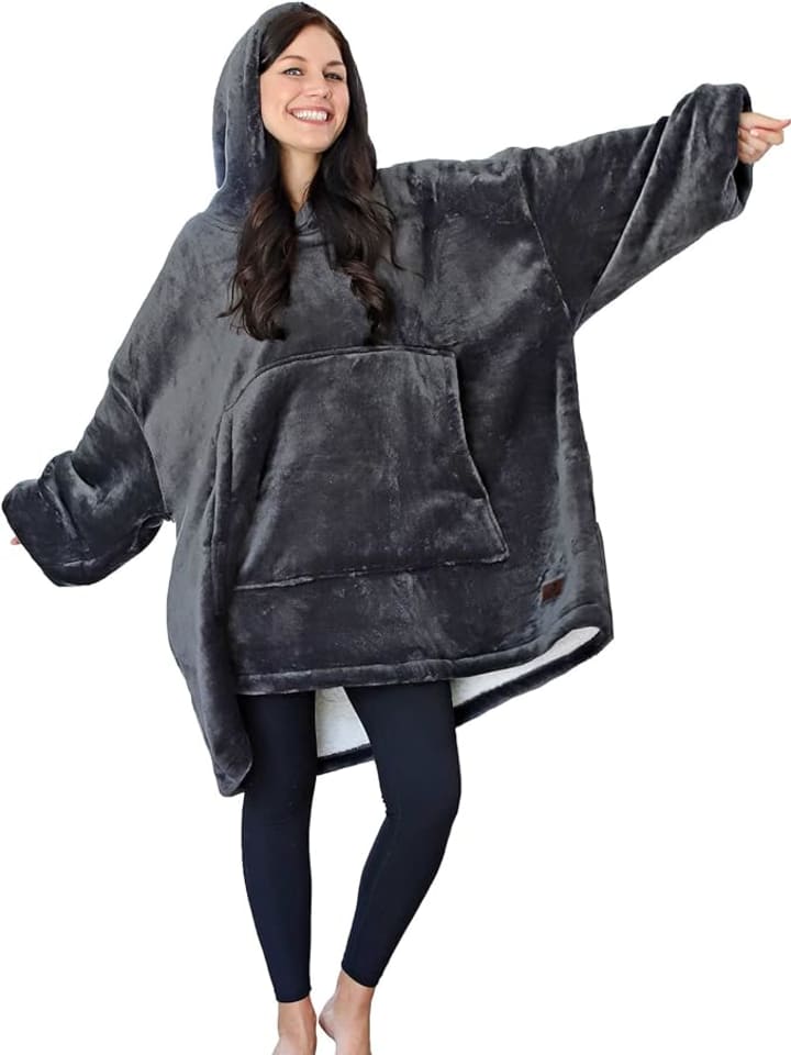 Woman wearing gray blanket hoodie