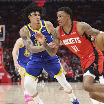 Apr 20, 2025; Houston, Texas, USA; Houston Rockets forward Jabari Smith Jr. (10) drives with the ball as Golden State Warriors forward Gui Santos (15) defends during the third quarter at Toyota Center. Mandatory Credit: Troy Taormina-Imagn Images
