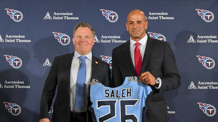 Jan 29, 2026; Nashville, TN, USA;  Tennessee Titans general manager Mike Borgonzi and Tennessee Titans head coach Robert Saleh holds up the Titans jersey during the press conference at Ascension Saint Thomas Sports Park. Mandatory Credit: Steve Roberts-Imagn Images