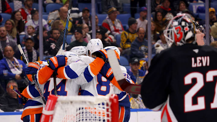 Nov 1, 2024; Buffalo, New York, USA;  New York Islanders center Jean-Gabriel Pageau (44) celebrates his goal with teammates during the third period against the Buffalo Sabres at KeyBank Center. Mandatory Credit: Timothy T. Ludwig-Imagn Images