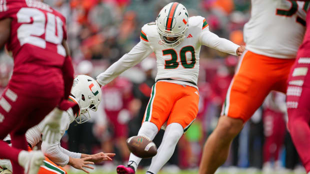 Miami Hurricanes place kicker Andres Borregales (30) kicks an extra point in the first quarter against the Temple Owls at Lin