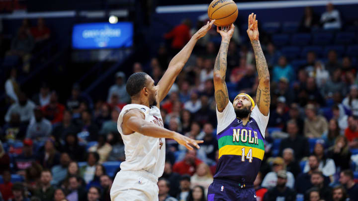 Feb 10, 2023; New Orleans, Louisiana, USA; New Orleans Pelicans forward Brandon Ingram (14) shoots the ball against Cleveland Cavaliers forward Evan Mobley (4) during the third quarter at Smoothie King Center. Mandatory Credit: Andrew Wevers-USA TODAY Sports