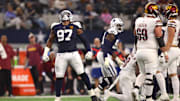 Nov 23, 2023; Arlington, Texas, USA; Dallas Cowboys defensive tackle Osa Odighizuwa (97) celebrates a sack in the second half against the Washington Commanders at AT&T Stadium. Mandatory Credit: Tim Heitman-Imagn Images
