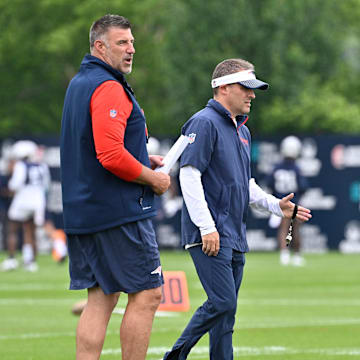 Jun 9, 2025; Foxborough, MA, USA; New England Patriots head coach Mike Vrabel (L) and offensive coordinator Josh McDaniels (R) watch over practice during minicamp at Gillette Stadium. Mandatory Credit: Eric Canha-Imagn Images