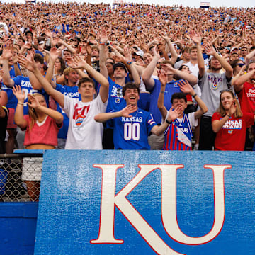 Aug 29, 2025; Lawrence, Kansas, USA; Kansas Jayhawks student fans celebrate a touch down during the first half against the Wagner Seahawks  at David Booth Kansas Memorial Stadium. Mandatory Credit: William Purnell-Imagn Images