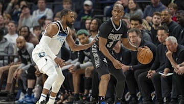 Mar 9, 2025; Minneapolis, Minnesota, USA; San Antonio Spurs guard Chris Paul (3) dribbles the ball as Minnesota Timberwolves guard Mike Conley (10) plays defense in the second half at Target Center.