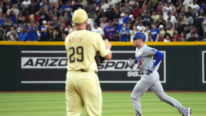 Aug 31, 2024; Phoenix, Arizona, USA; Los Angeles Dodgers first base Freddie Freeman (5) runs the bases after hitting a solo home run against Arizona Diamondbacks pitcher Merrill Kelly (29) during the first inning at Chase Field. Mandatory Credit: Joe Camporeale-USA TODAY Sports