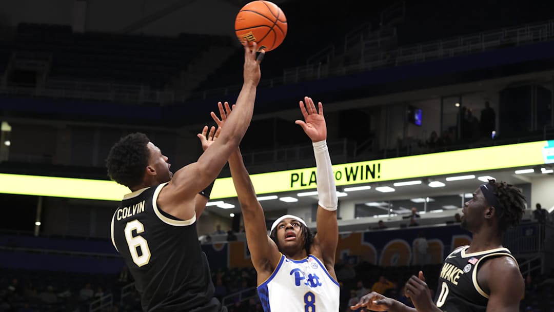 Jan 27, 2026; Pittsburgh, Pennsylvania, USA;  Wake Forest Demon Deacons guard Myles Colvin (6) shoots against Pittsburgh Panthers guard Omari Witherspoon (8) during the second half at the Petersen Events Center. Mandatory Credit: Charles LeClaire-Imagn Images