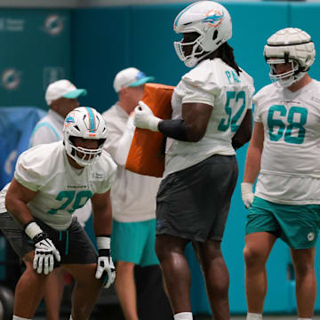 Miami Dolphins offensive tackle Larry Borom (79) works with offensive tackle Patrick Paul (52) during training camp at Baptist Health Training Complex.