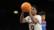 Apr 5, 2025; San Antonio, TX, USA; Auburn Tigers guard Tahaad Pettiford (0) shoots a free throw against the Florida Gators during the first half in the semifinals of the men's Final Four of the 2025 NCAA Tournament at the Alamodome.